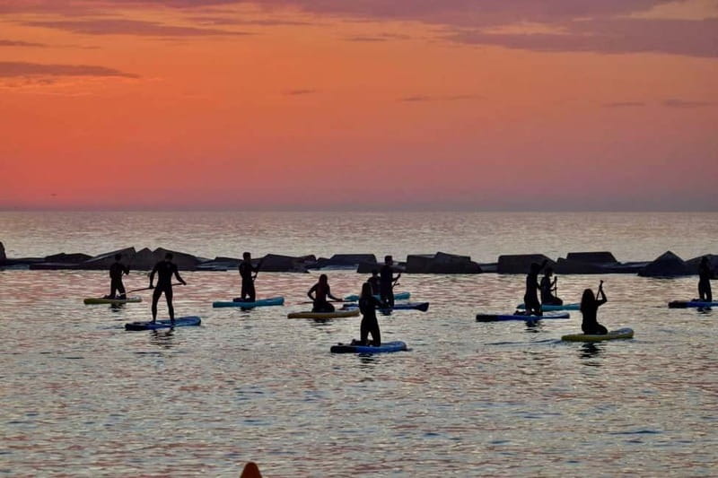 Barcelona: Paddleboarding at Sunrise. Includes: instructor, photos, equipment - Meeting at the Barceloneta surf school