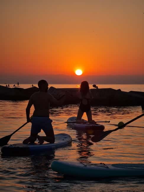 Barcelona: Paddleboarding at Sunrise. Includes: instructor, photos, equipment - Watching the sunrise from the sea