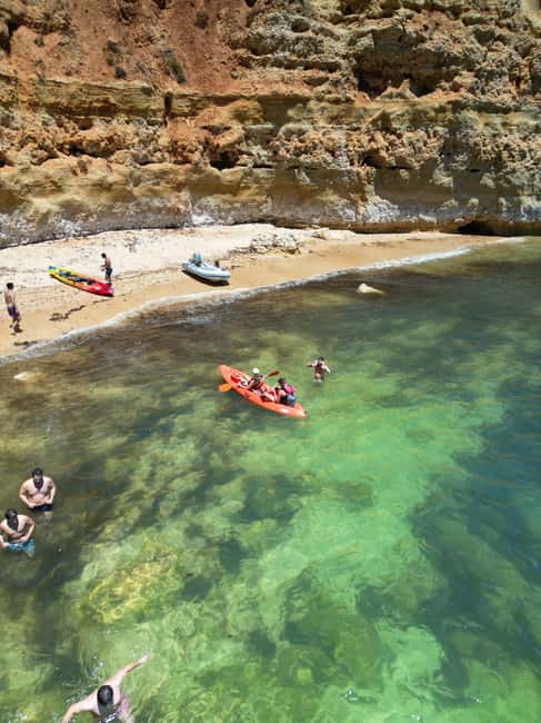 Benagil: Caves & Wild Beaches Tour w/ Local Guide, 4K Photos - Kayaking along the golden Algarve cliffs