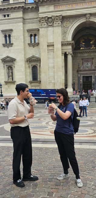Budapest: Walking Tour with Chimney Cake & Polaroid Photos - Vörösmarty Square, cafés, and the Danube