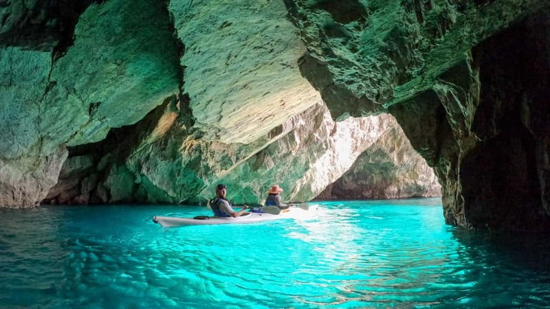 Capri: Caves and Beaches Kayaking Tour with GoPro Photos - Green Caves, blue light, and a swim stop