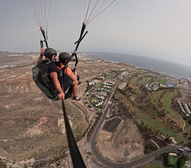 Costa Adeje, Paragliding with pick up service and 5 free photos! - Landing on the coast and collecting your photos