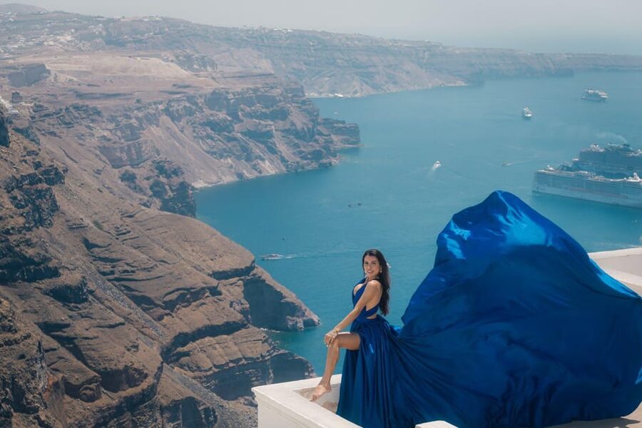 Flying dress Photoshoot in Santorini with Hotel Pickup - Imerovigli, blue domes, and Caldera views