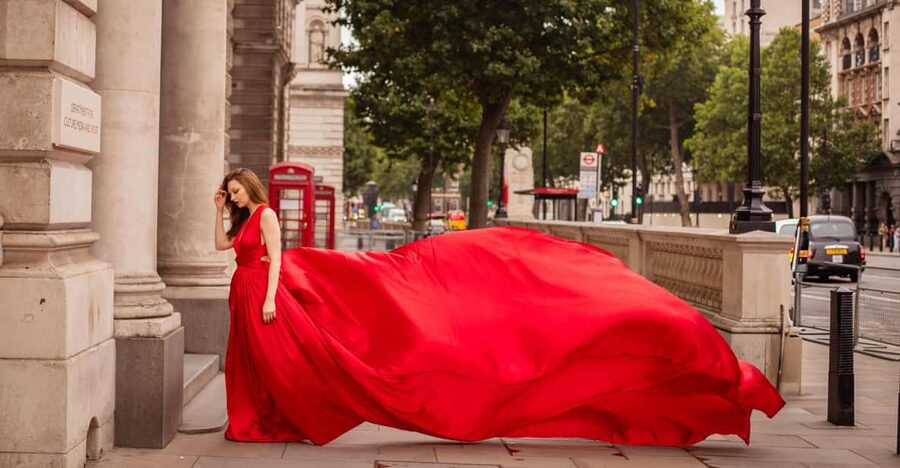 Flying dress professional photoshoot with pro photographer - A red gown against London’s most recognizable sights