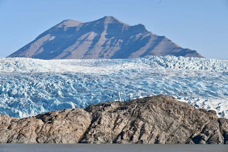 From Longyearbyen: Pyramiden Private Photo Tour w/ Transfer - The morning pickup and boat transfer from Longyearbyen