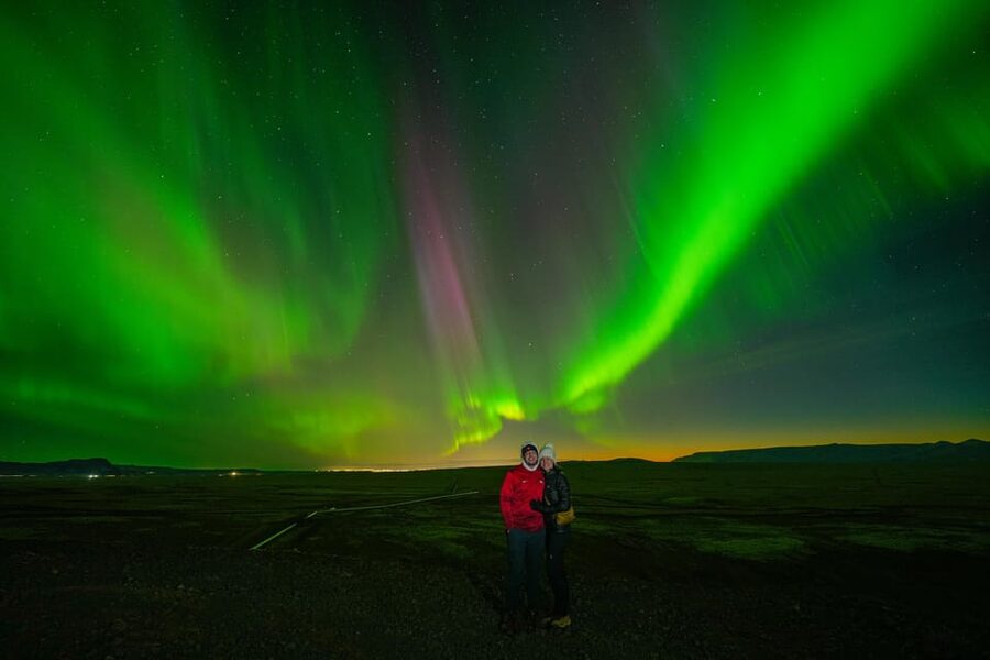 Reykjavik: Northern Lights Tour with Private Photographer - Icelandic snacks beside the night sky
