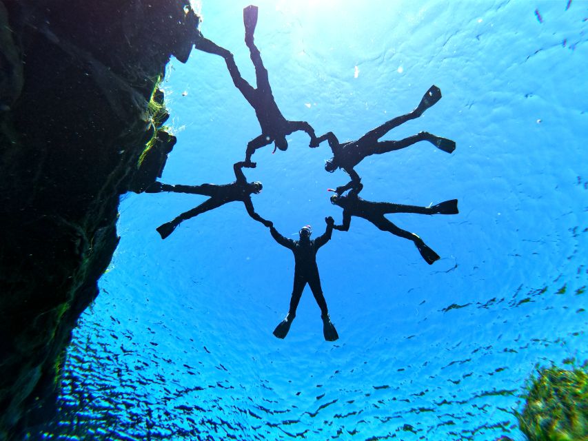 Silfra: Half-Day Snorkeling Day Trip with Underwater Photos - Getting into the drysuit takes patience