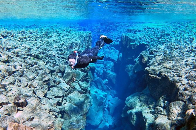 Silfra Wetsuit Snorkeling Tour with Underwater Photos - From Reykjavik - Entering the 2°C water